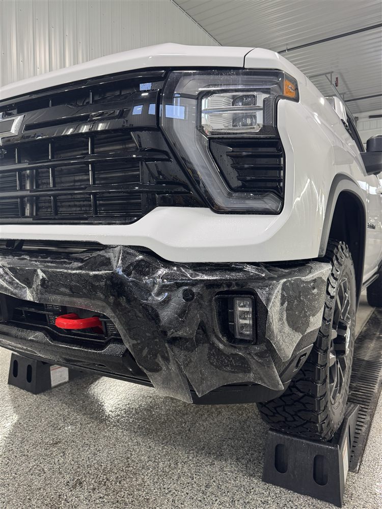 Before PPF install on GMC truck front bumper